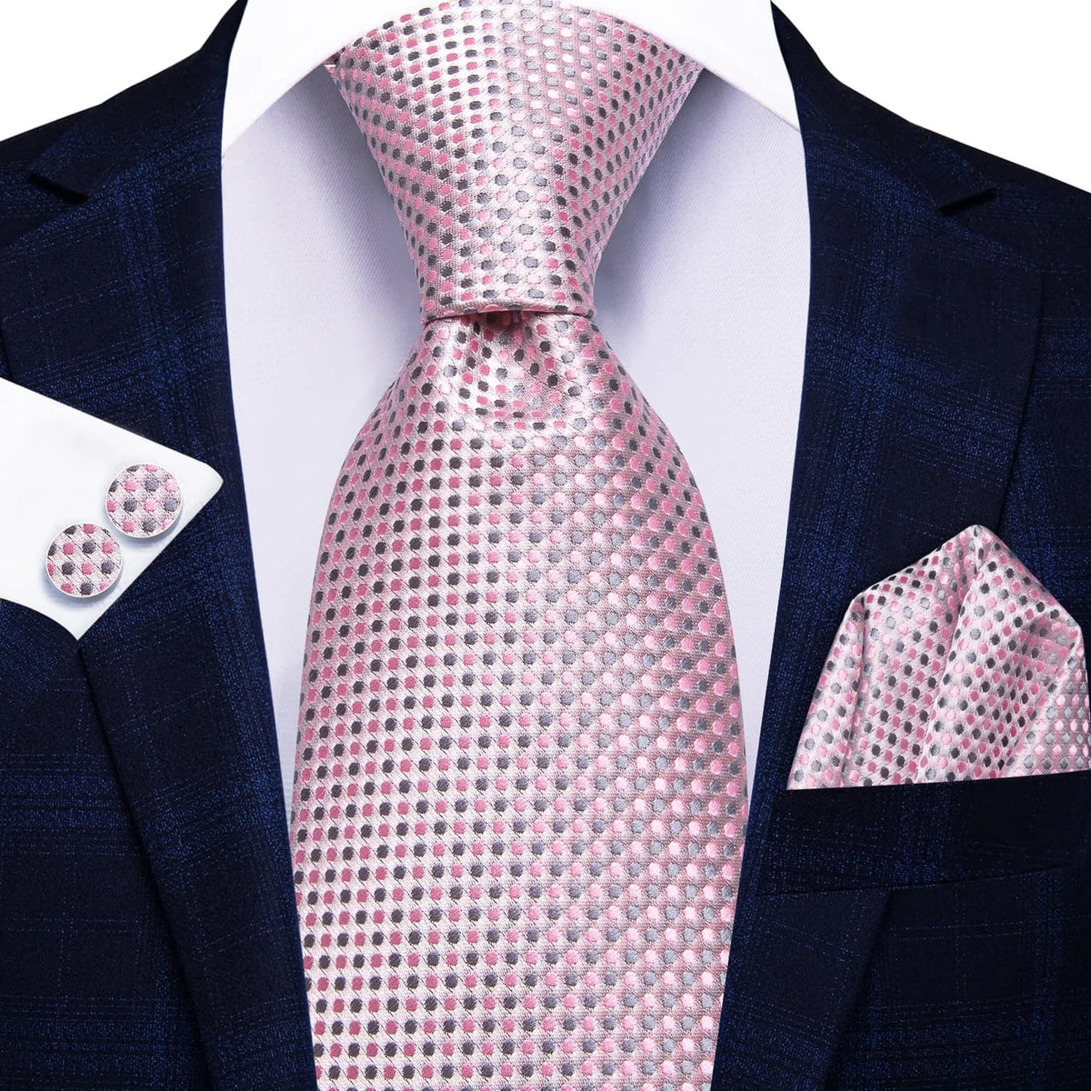 Pink and gray micro dot silk tie worn with navy suit, pocket square and cufflinks