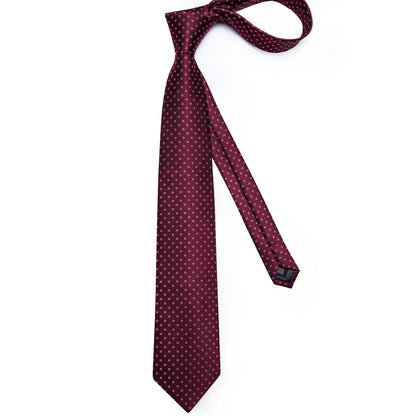 Full-length burgundy silk tie with small geometric diamond pattern