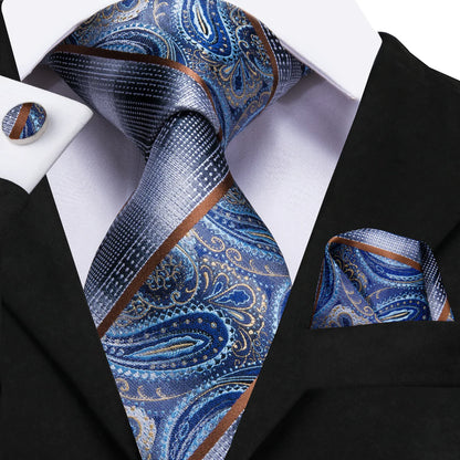 blue silver paisley silk tie with brown accents worn with suit elegant mens formal style