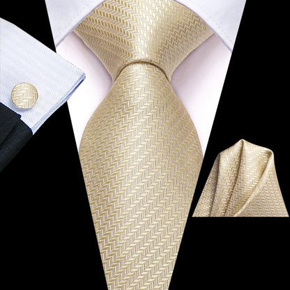 Champagne gold herringbone tie with matching pocket square and cufflink styled with navy suit