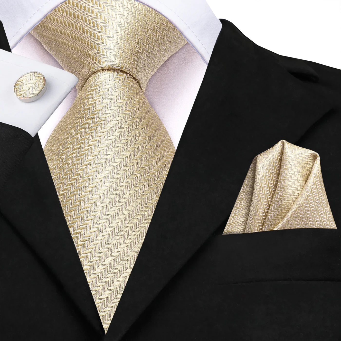 Champagne gold herringbone tie and pocket square set styled with black suit