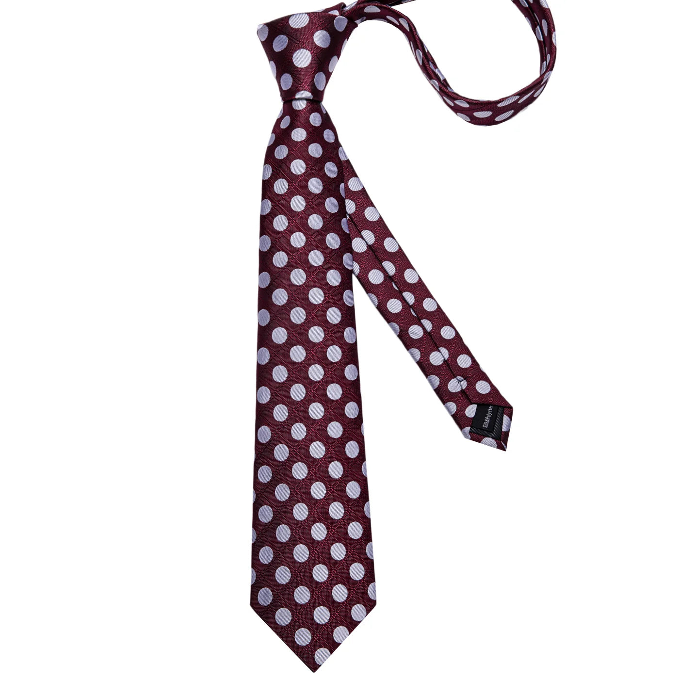 Full-length burgundy polka dot silk tie on white background