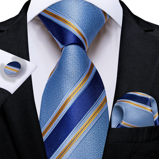 light blue and navy striped silk tie with gold accent stripes styled with white shirt and suit