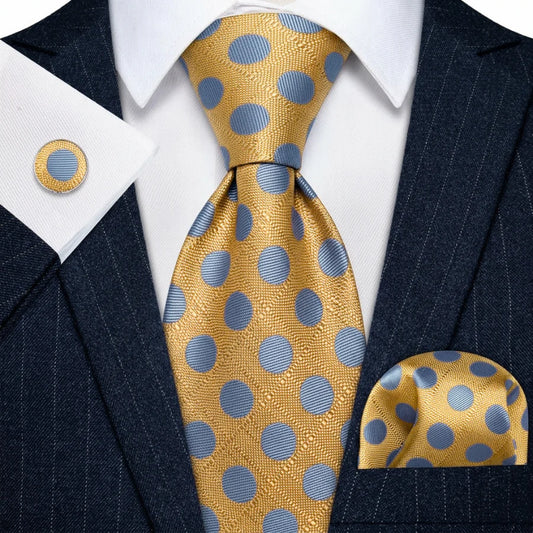 Gold and light blue polka dot tie set styled with matching pocket square and cufflink