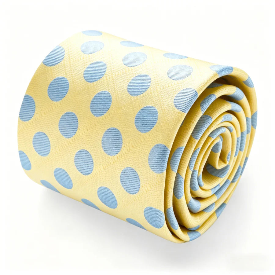 Rolled yellow and light blue polka dot silk tie close up
