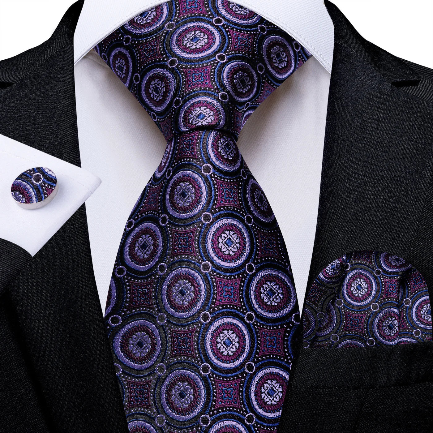 Purple medallion silk tie with matching pocket square and cufflinks styled with black suit