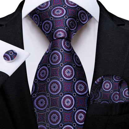 Purple medallion silk tie with matching pocket square and cufflinks styled with black suit