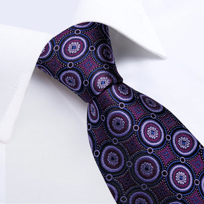 Close-up of purple medallion silk necktie with detailed woven pattern