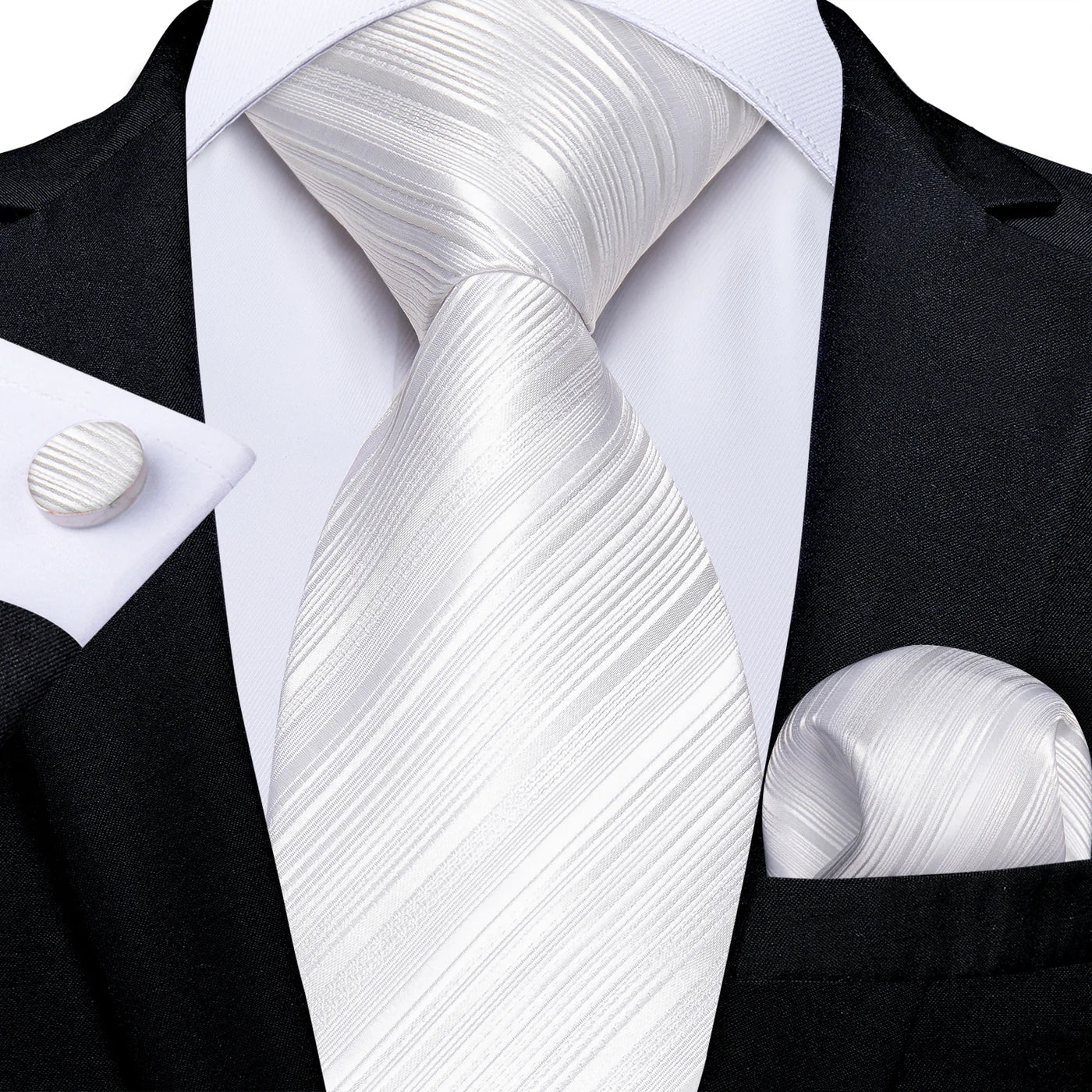 white textured striped silk tie worn with black suit pocket square and cufflinks