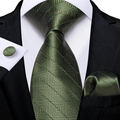 Dark green geometric silk tie set styled with matching pocket square and cufflink