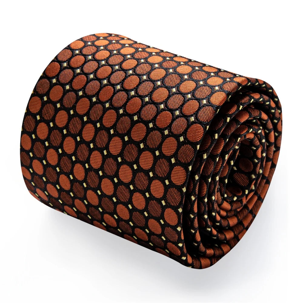Rolled brown geometric silk tie showing woven circle pattern and textured finish