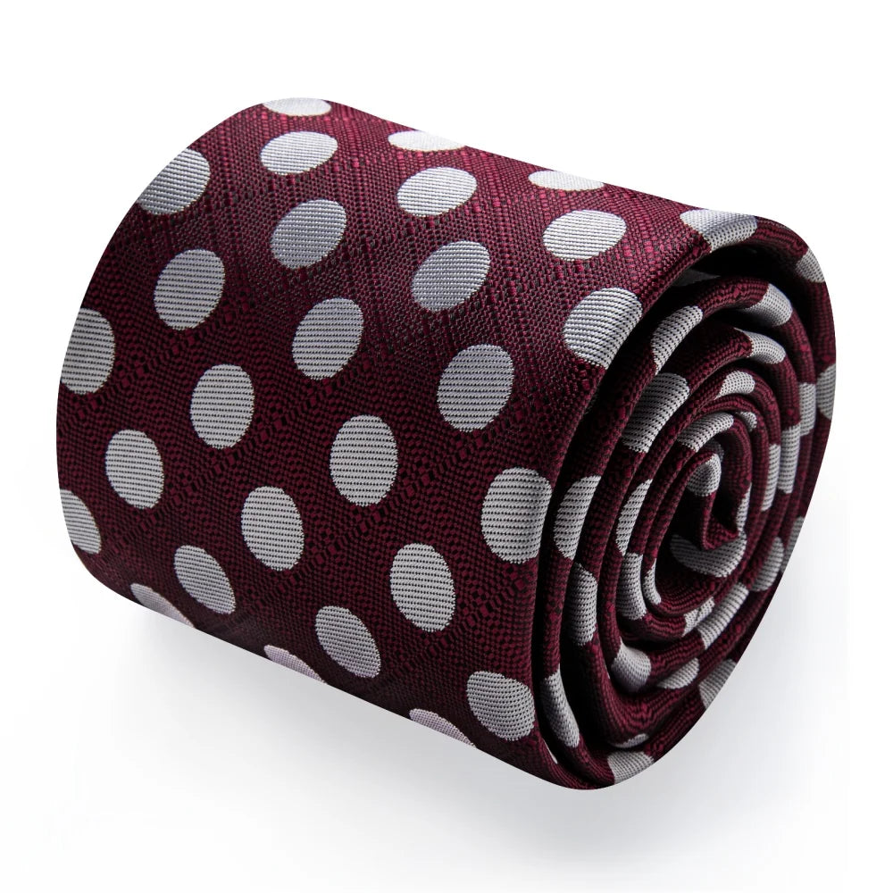 Rolled burgundy polka dot silk necktie showing silver dot pattern and woven texture